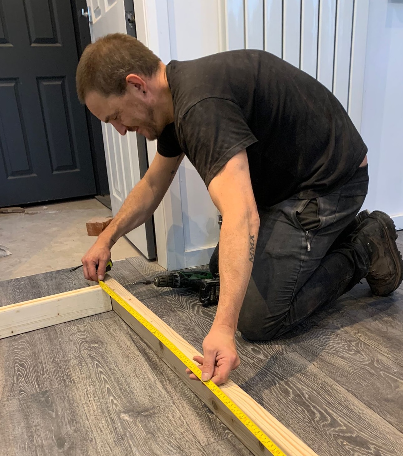 Steve measuring wood